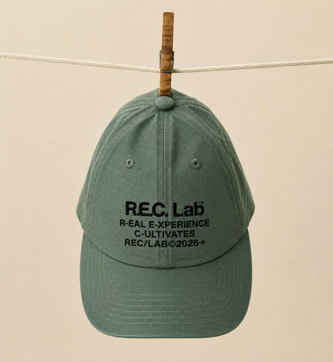 Green R.E.C.Lab ripstop cap on clothesline