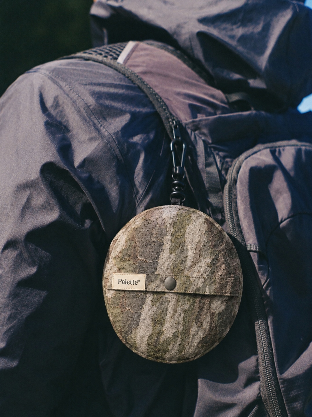 Trail — packable camo system on backpack